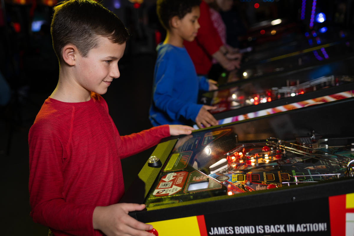 Playing pinball at Spinners