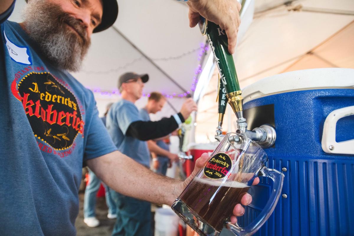 Man pouring a beer at Frederick Oktoberfest