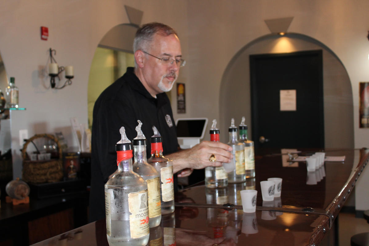 Man serving drinks at Dragon Distillery