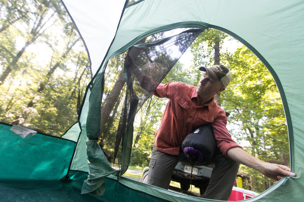 Man setting up a Camping Tent