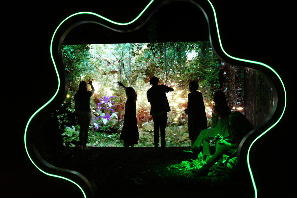 People enjoying an immersive experience at MAD Arts
