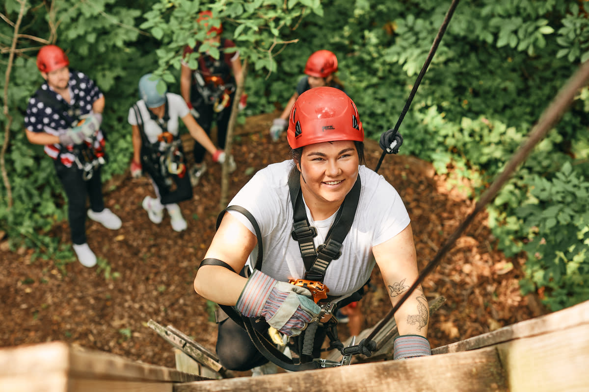 Woman on high ropes course