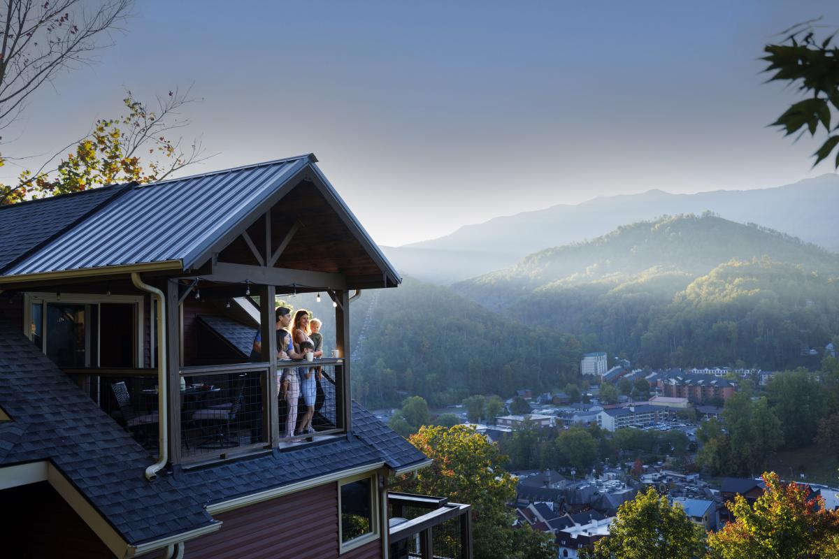 family at cabin balcony