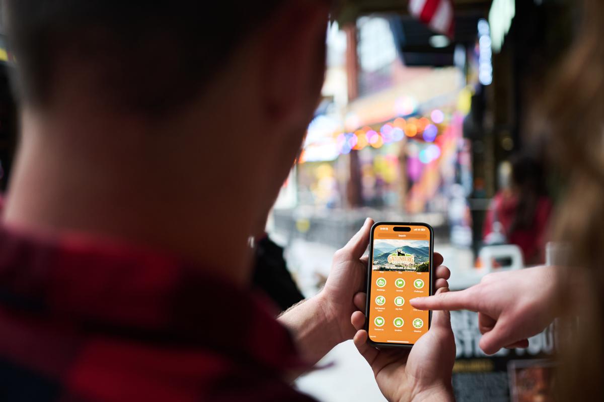 Man using Visit Gatlinburg mobile phone app