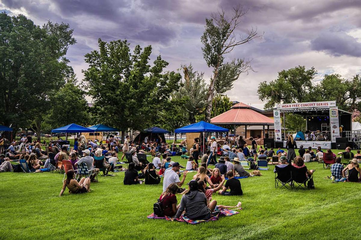 People sitting on the lawn of Swanny City Park