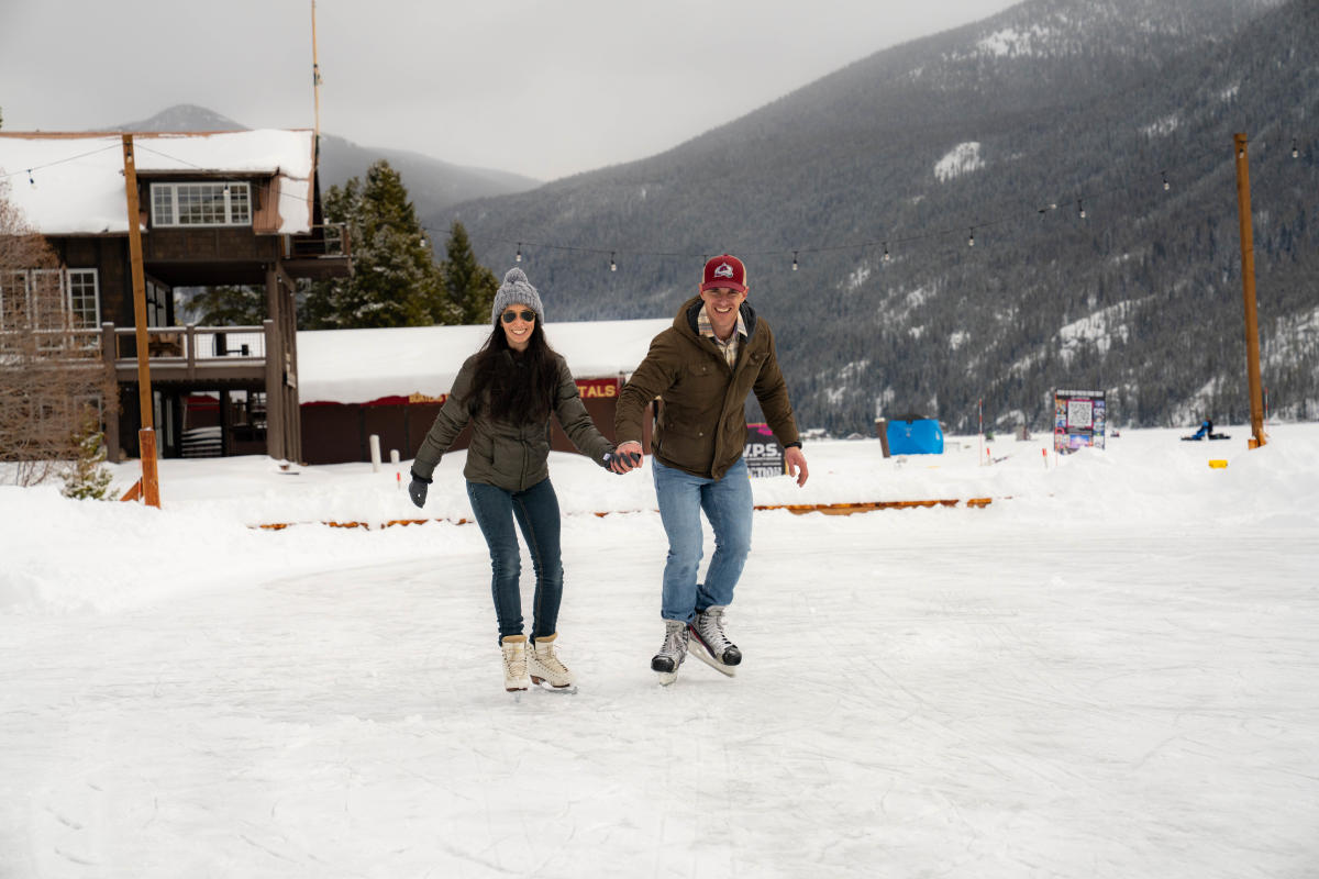Couple ice skating on Grand Lake