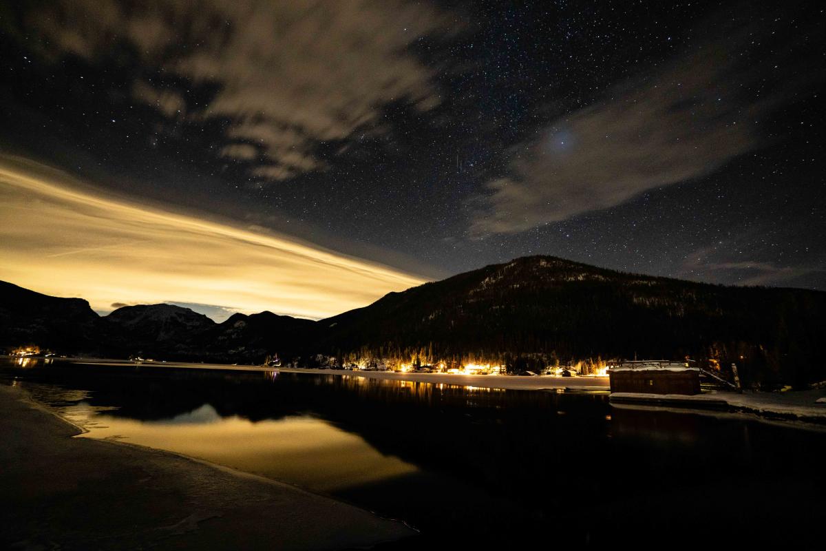 View of Grand Lake and the night sky showing Mount Baldy, the lake and stars