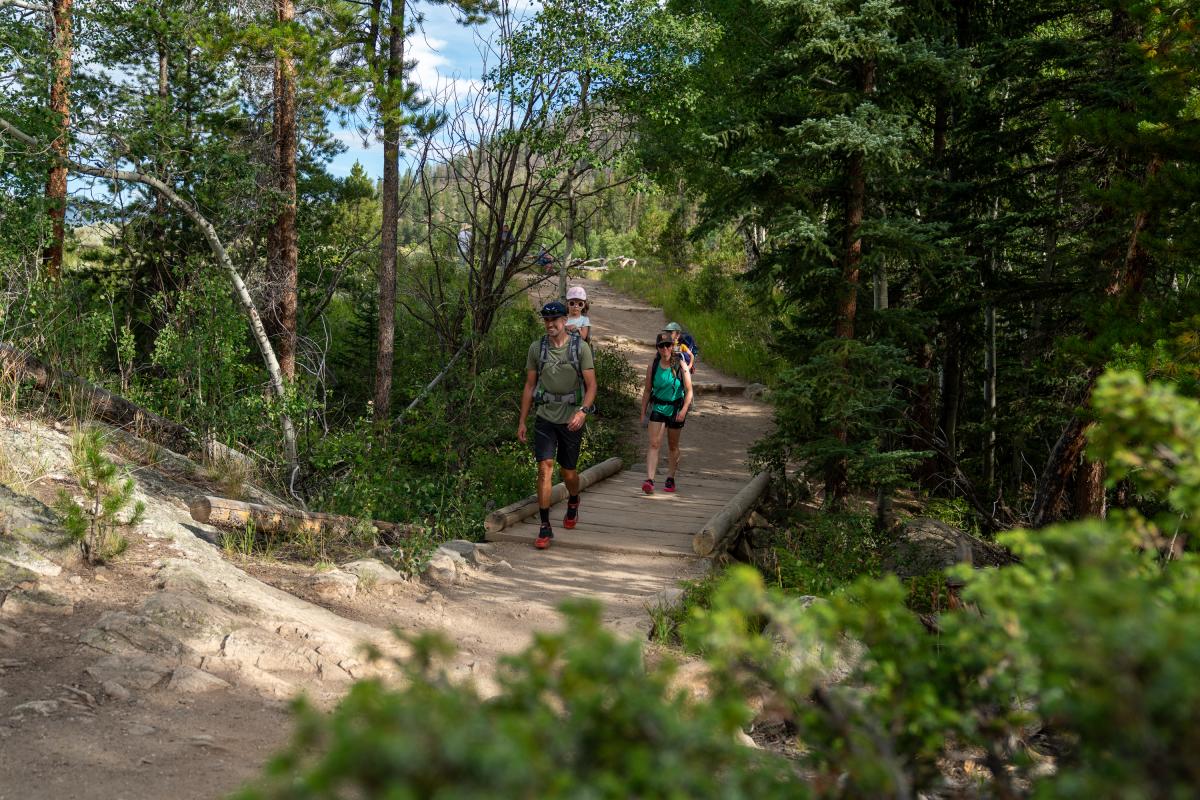 Family with young children on a trail in Rocky Mountain National Park