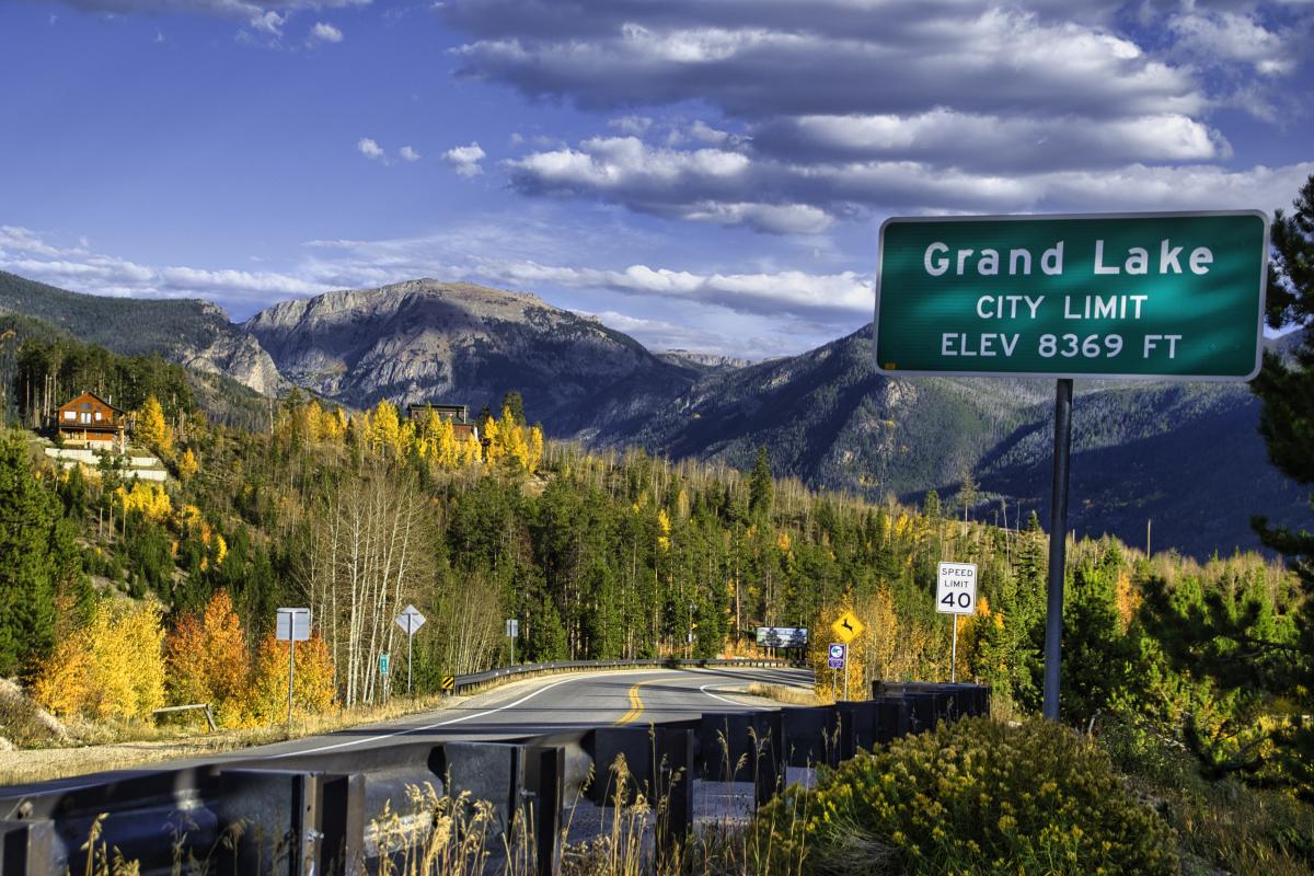 Grand Lake city limit sign in the fall colors with elevation 8369
