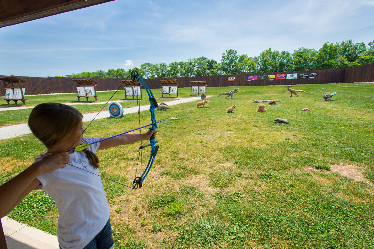 Kid Shooting A Bow At Strawtown Koteewi Park In Hamilton County, IN