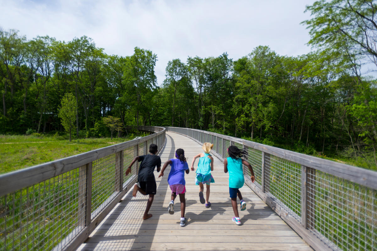 Kids Running Down The Trail At Flat Fork Creek Park In Hamilton County, IN