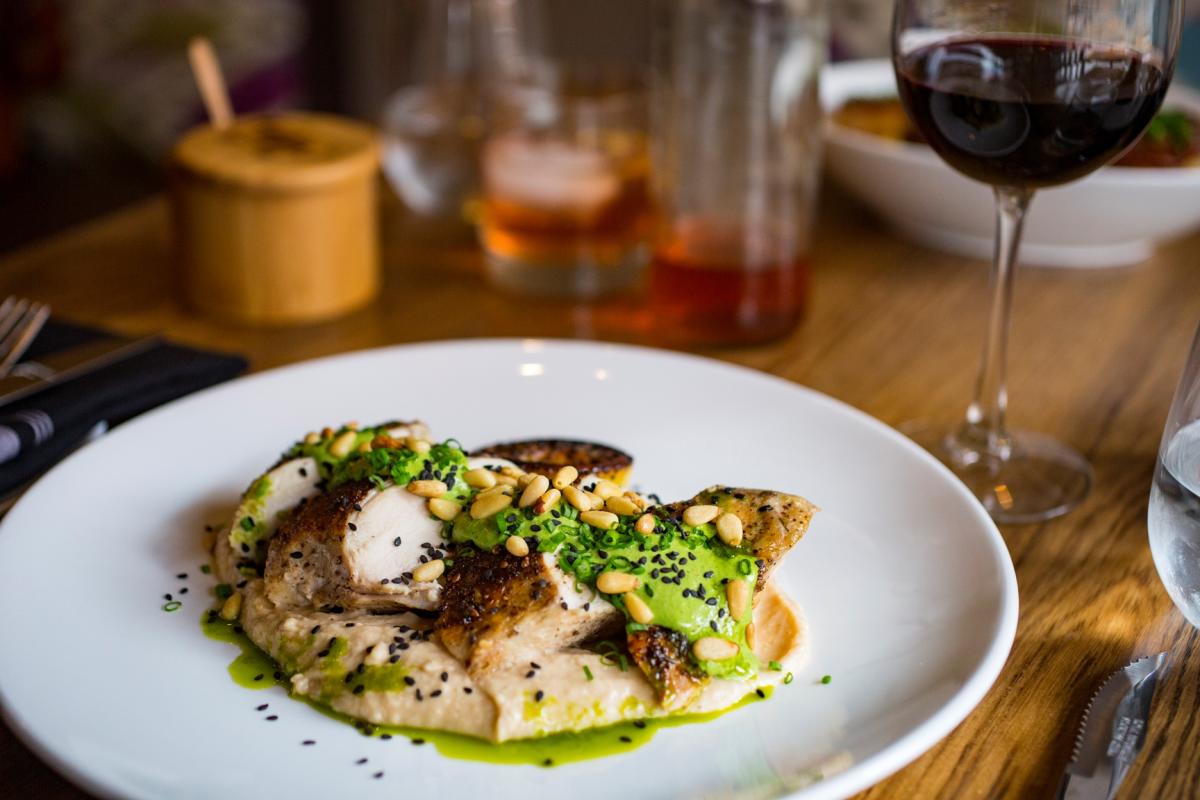 A chicken dinner with wine from Tolon restaurant in Fort Wayne