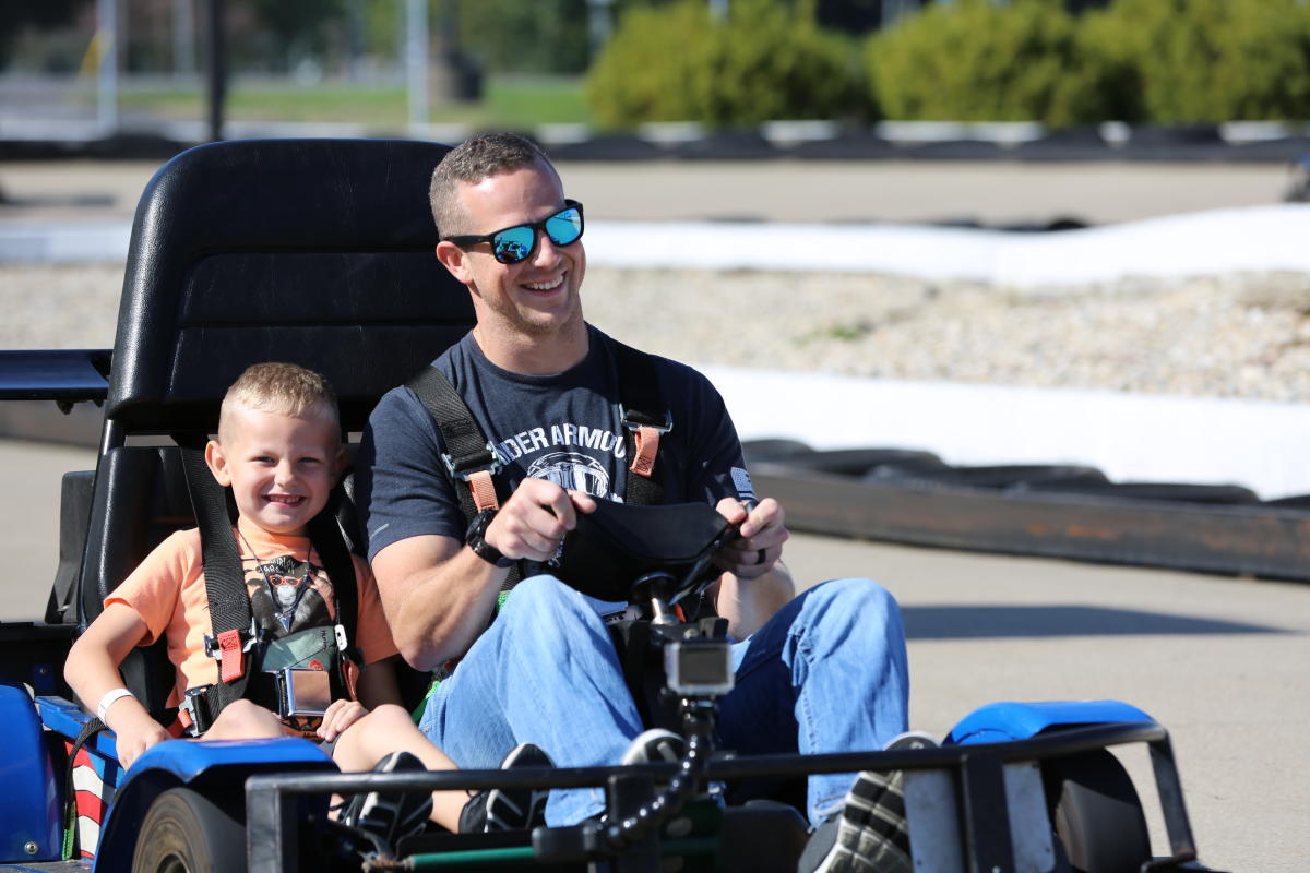 A father and son on a two-person go kart at Rascal's Fun Zone in Whiteland