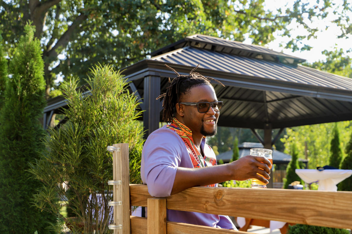 Man drinking beer outside