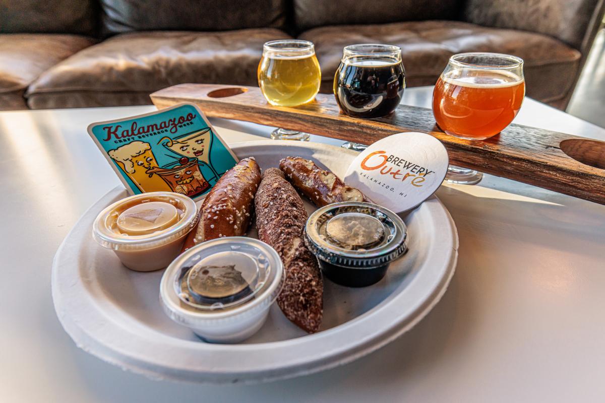 A plate with three pretzel sticks paired with three different dips is featured in Kalamazoo Craft Beverage Week.