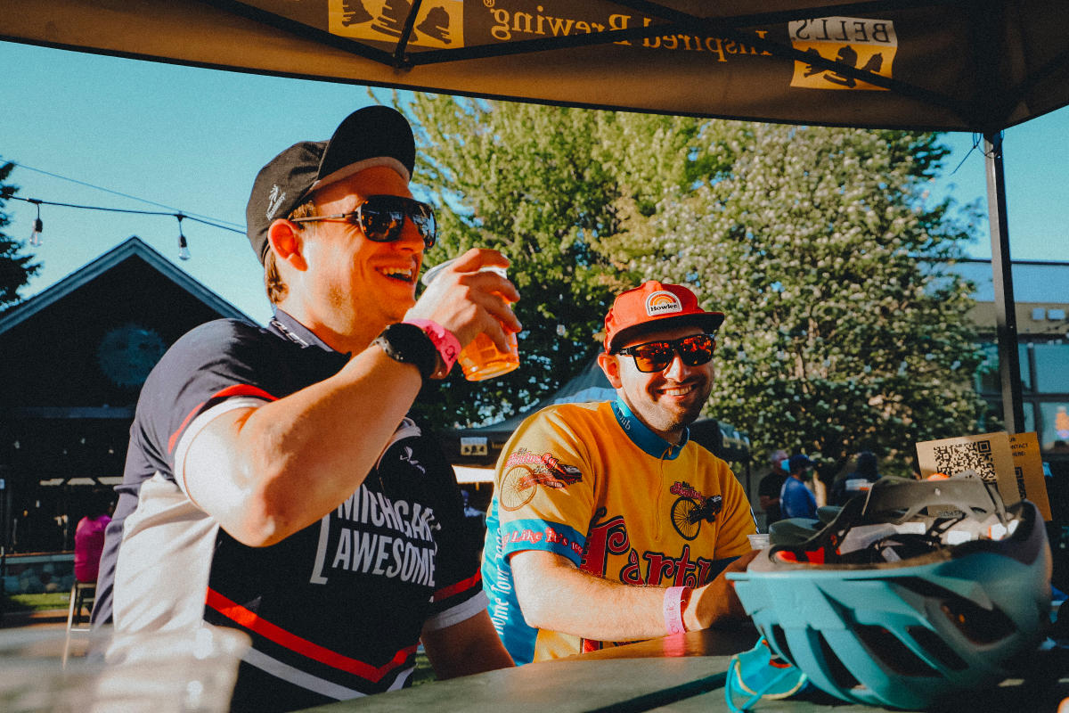 Friends enjoy a couple beers together outdoors