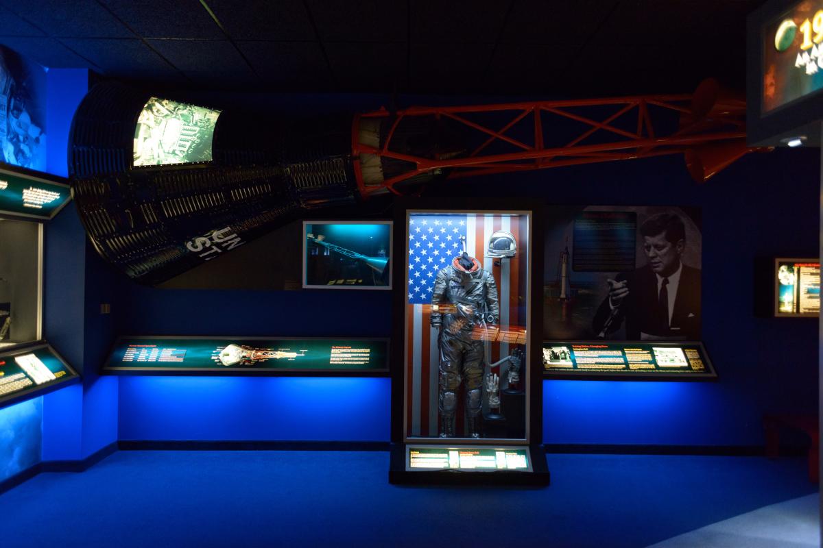 Museum exhibit of an astronaut suit in a case