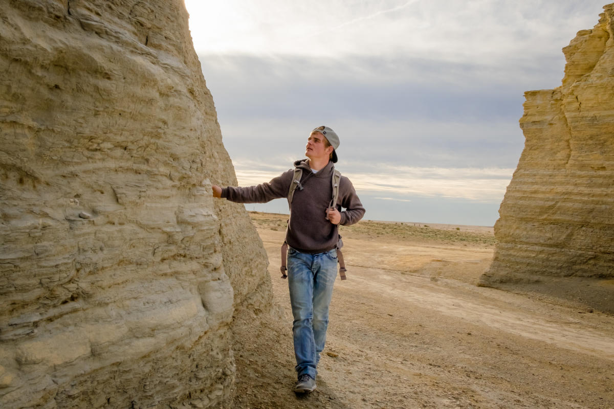 Monument Rocks Western Vistas Byway Sign Hiker