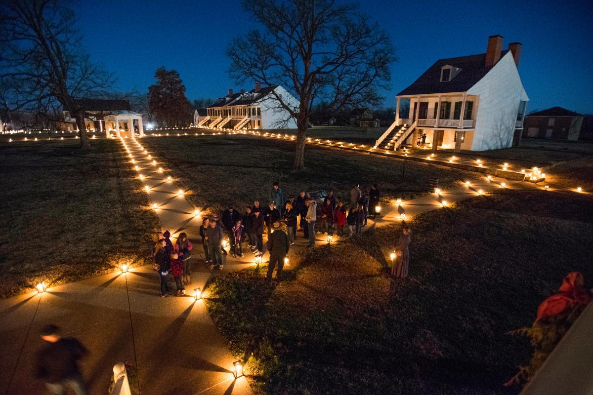 Tour group gathers at Fort Scott Candlelight Tour