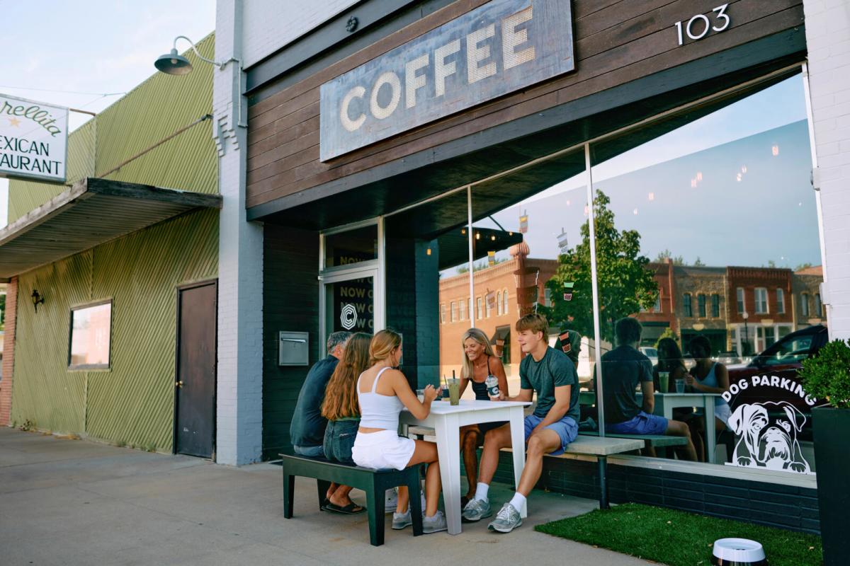 Young people outside of Octagon City Coffee in Humboldt, KS
