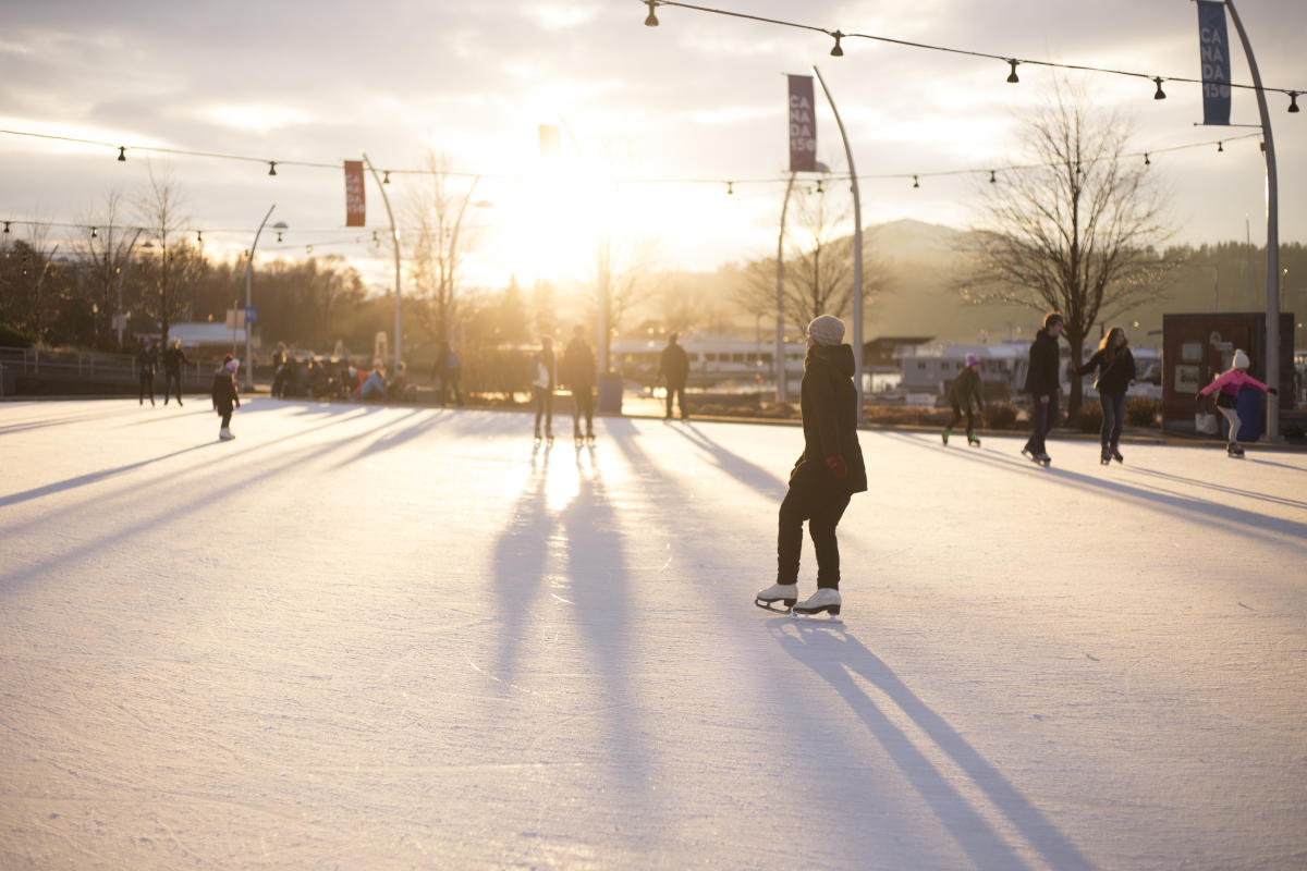 Skaters enjoy the last light of the day at Stuart Park ice rink