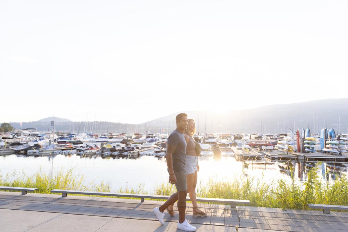 Couple Walking on the Waterfront Boardwalk