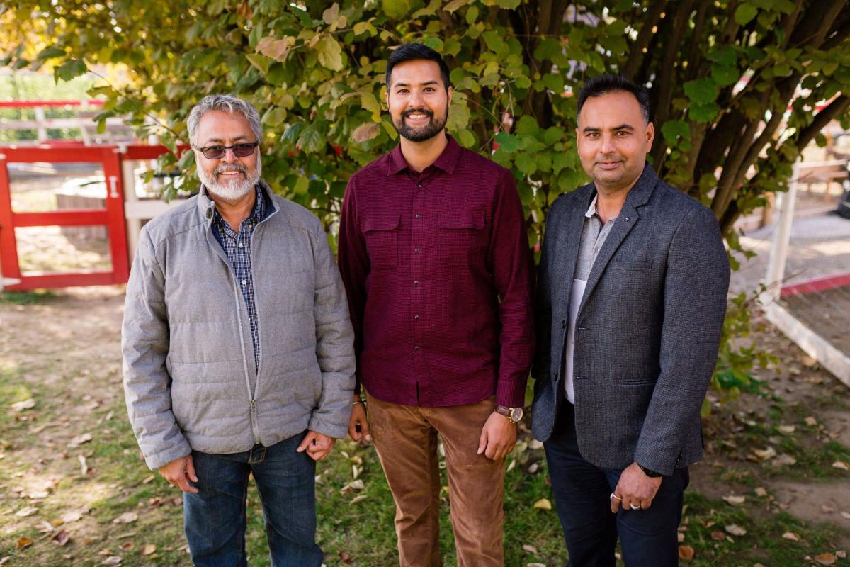 Jas (middle) with his uncle, Satnam Basran (left), and his older brother, Kam Sanghera (right