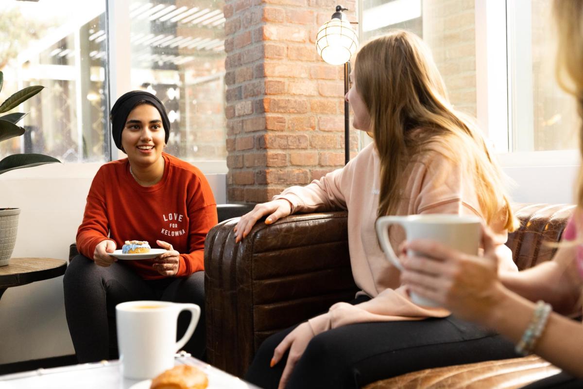 People enjoying cups of coffee at Third Space Coffee