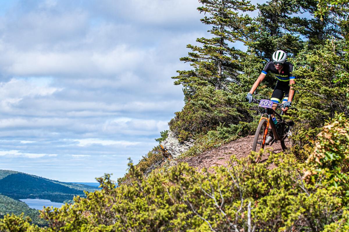 A rider from Trails Fest 2022 lives life on the edge in Copper Harbor.