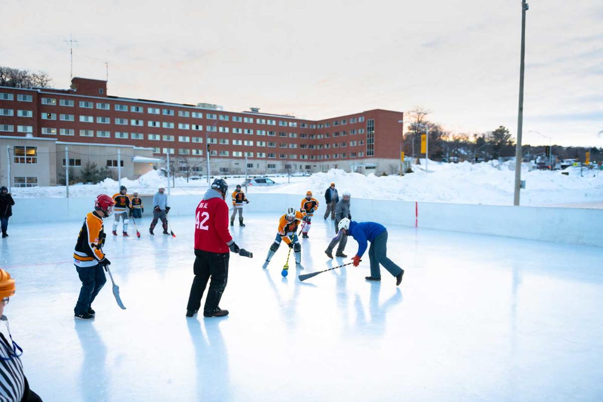 Students play a game of broomball during Winter Carnival.