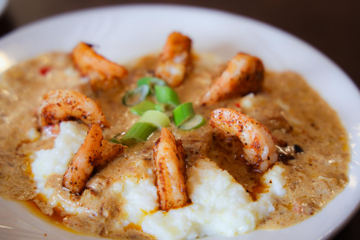 a bowl of southern style shrimp and grits