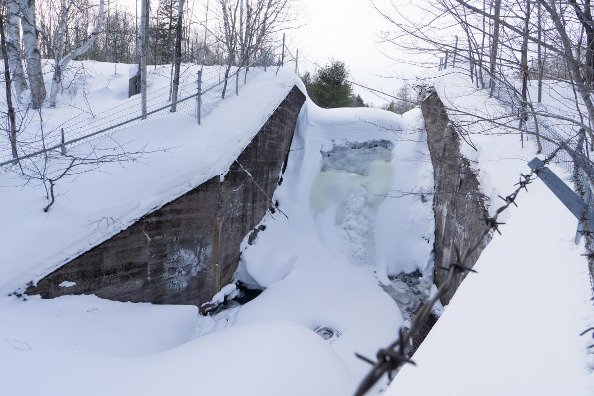 The concrete dam at Hungarian Falls frozen over.