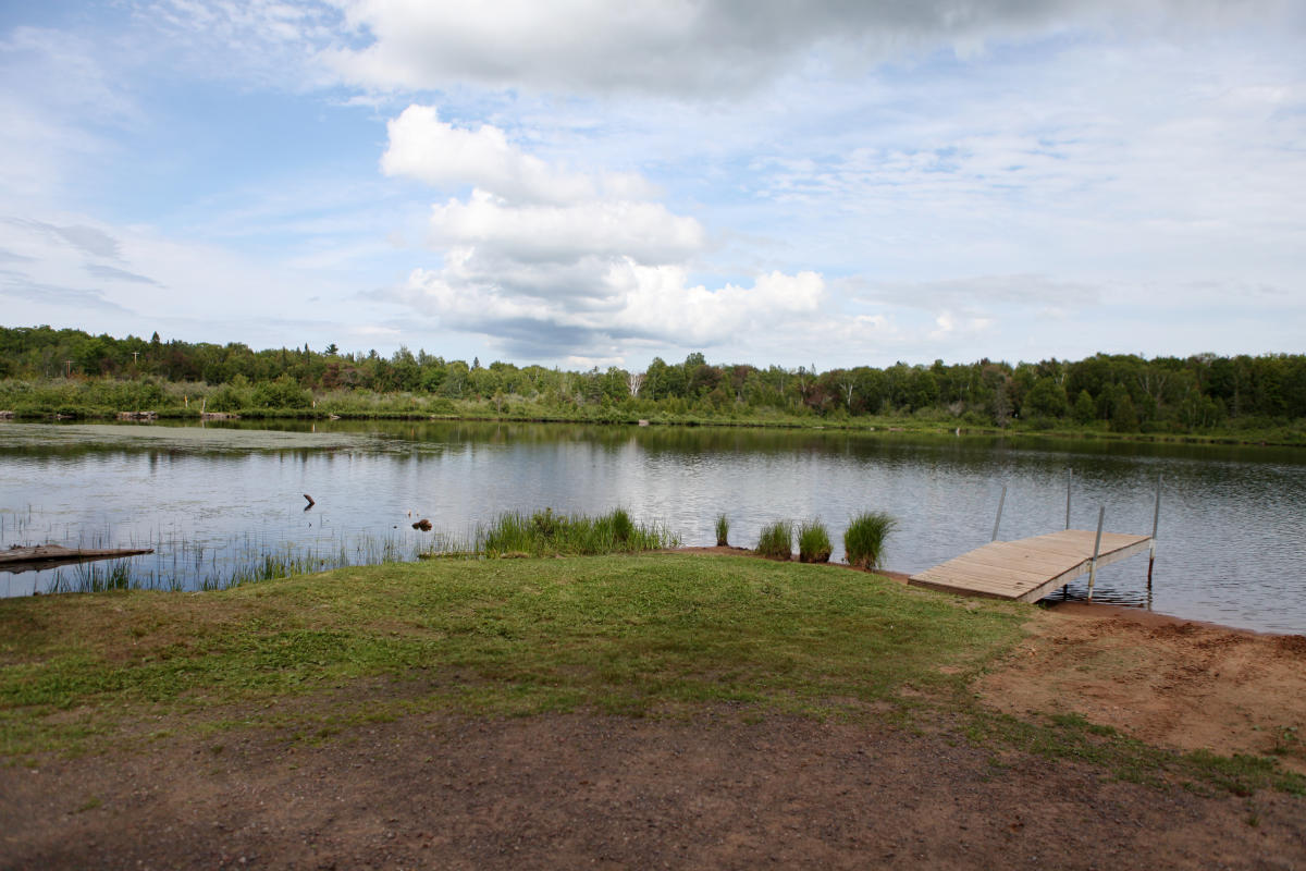 Seneca Lake with small dock and lily pads