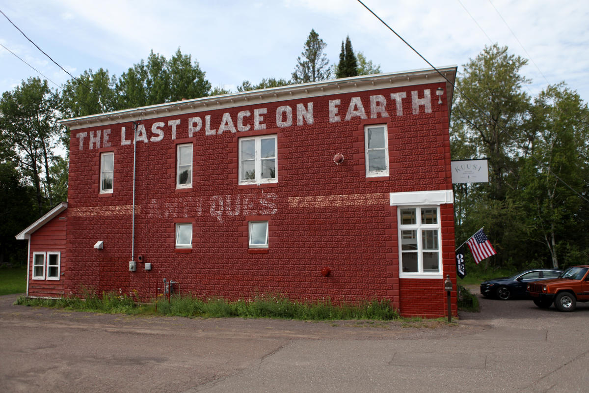 Red brick building with the words "The Last Place On Earth"