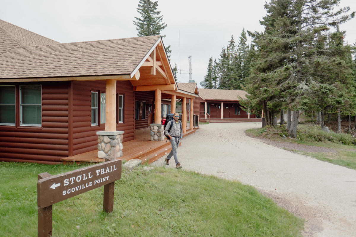 Visitors walking out of Greenstone Grill towards Stoll Trail