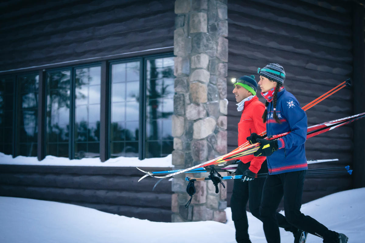 Skiiers carry their skis at the Keweenaw Mountain Lodge.