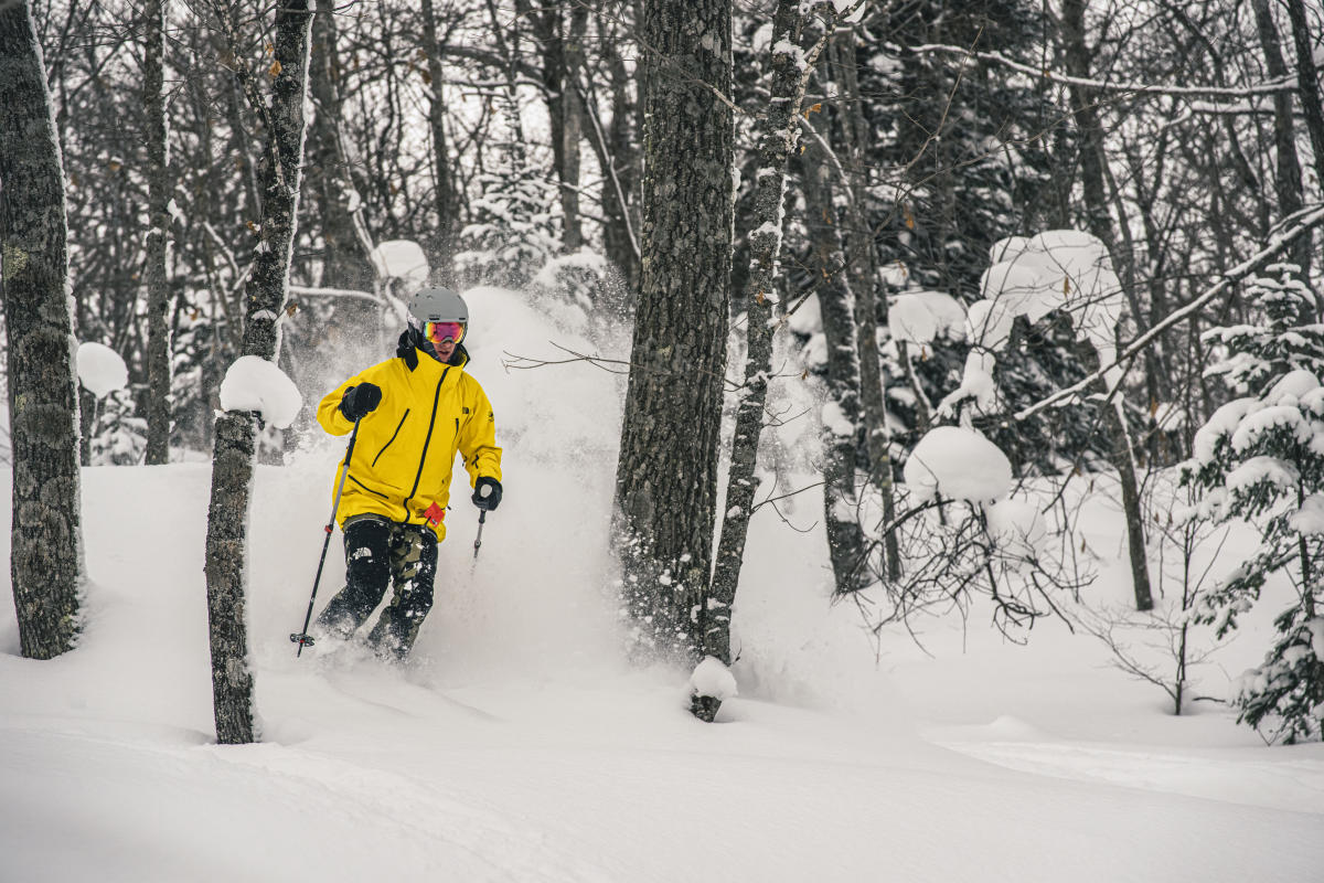 Skier in fresh powder at Mount Bohemia.