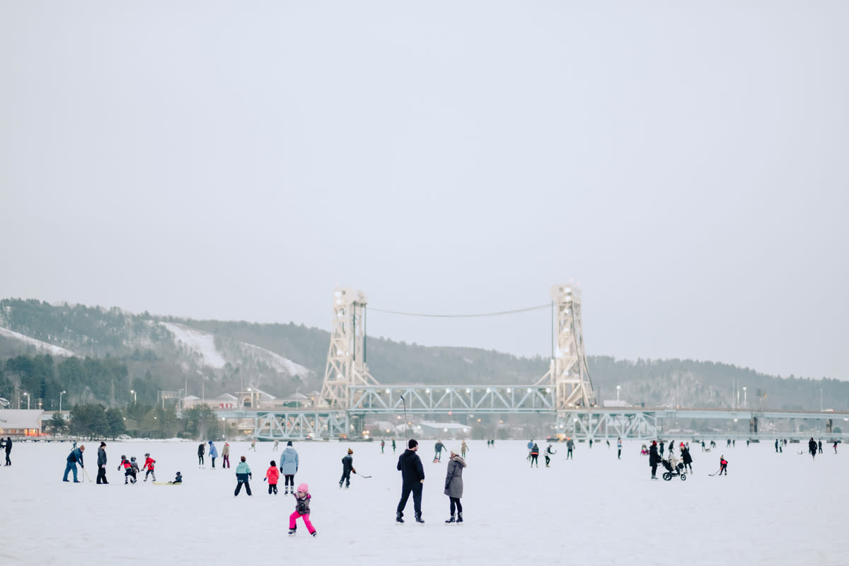 Ice skating in Houghton with Bridge in Background