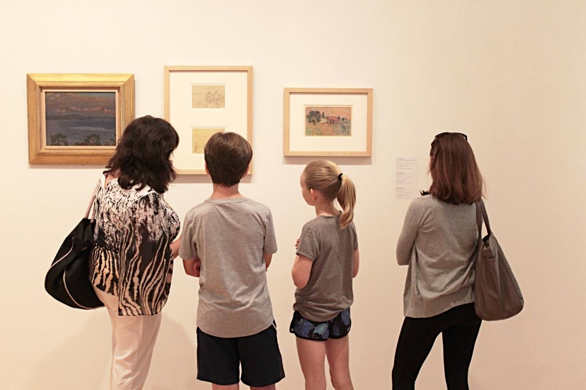Family admire artwork at the Hillard University Art Museum in Lafayette, LA