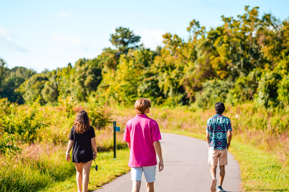 Family Walking In Fisher Farm Park