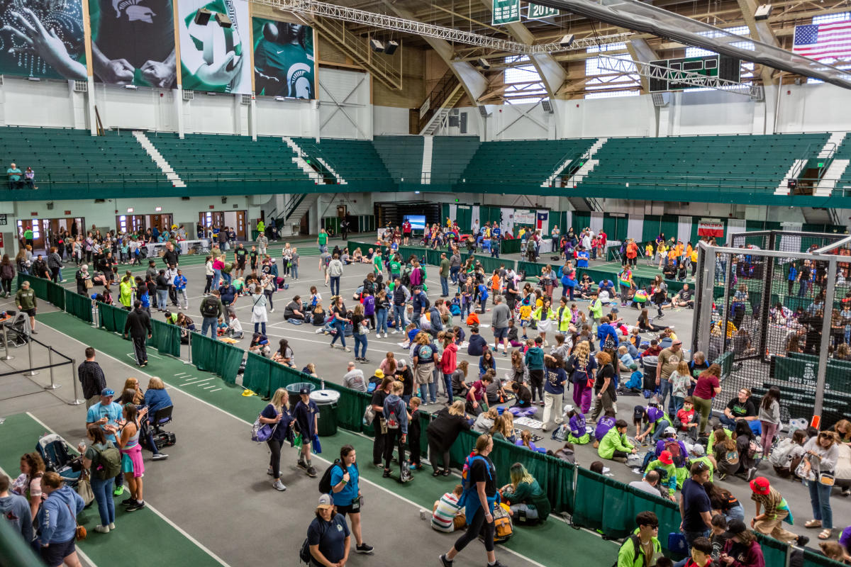 Hundreds of people gathered in a fieldhouse at MSU.