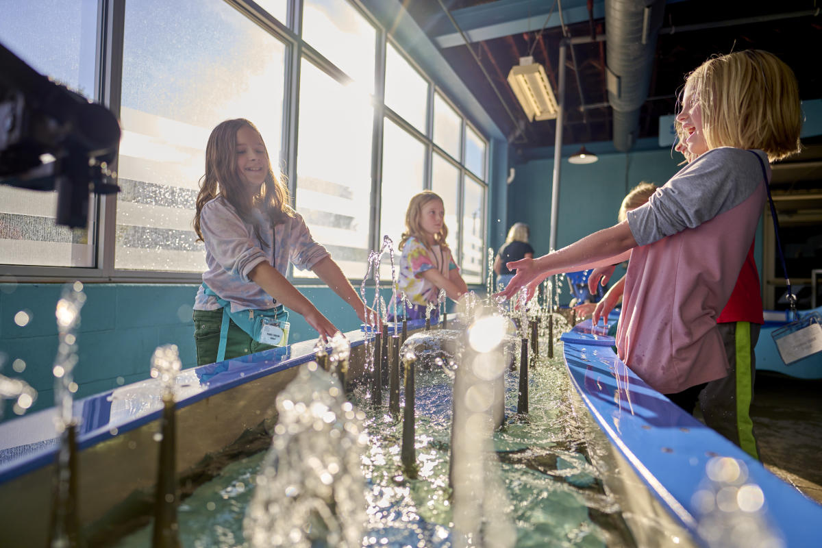 Girls playing in the water room at Impression 5 Science Center