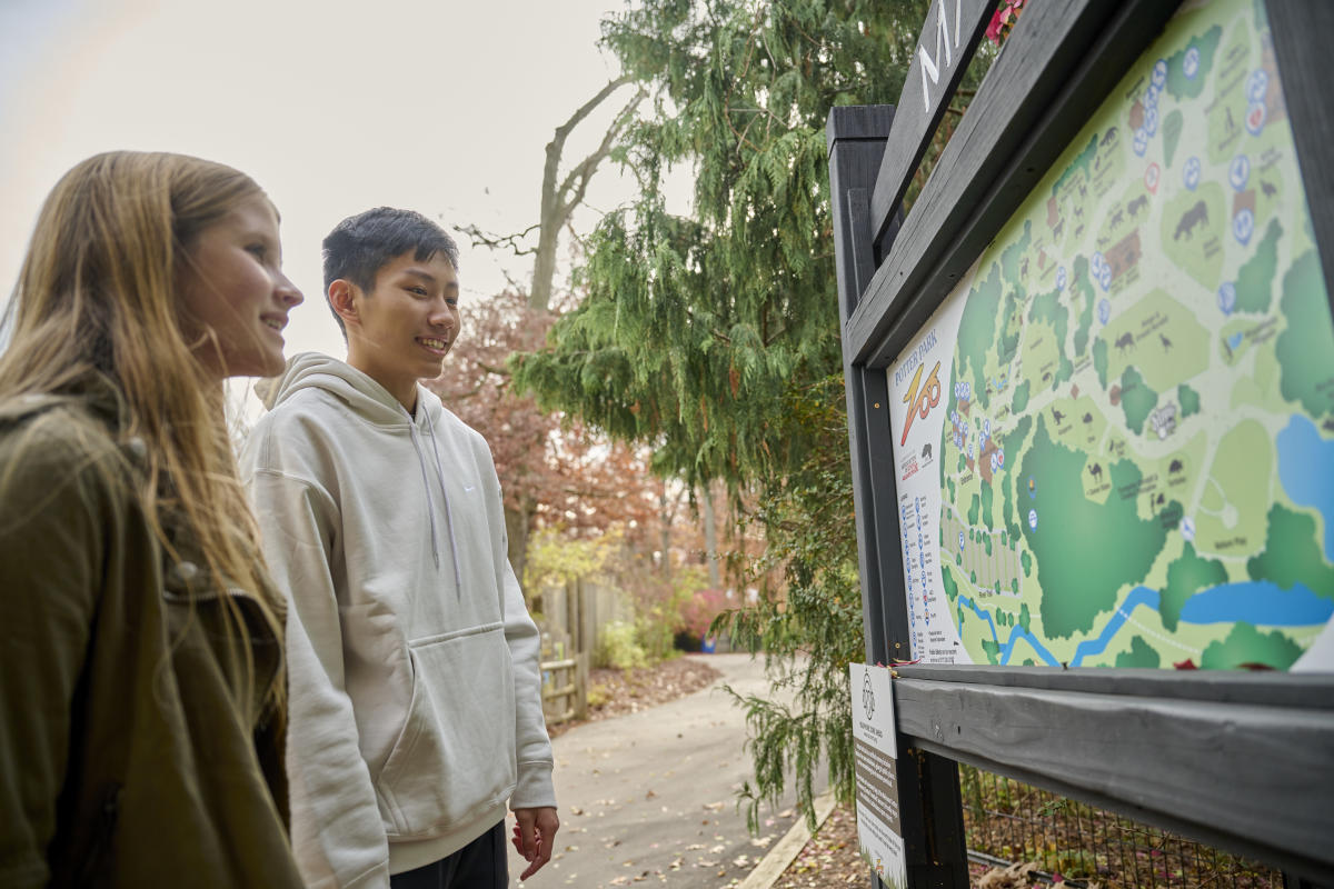Kids looking at a Potter Park Zoo map