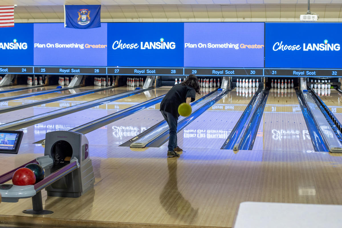 Person on a bowling lane about to throw the ball at Royal Scot Golf and Bowl