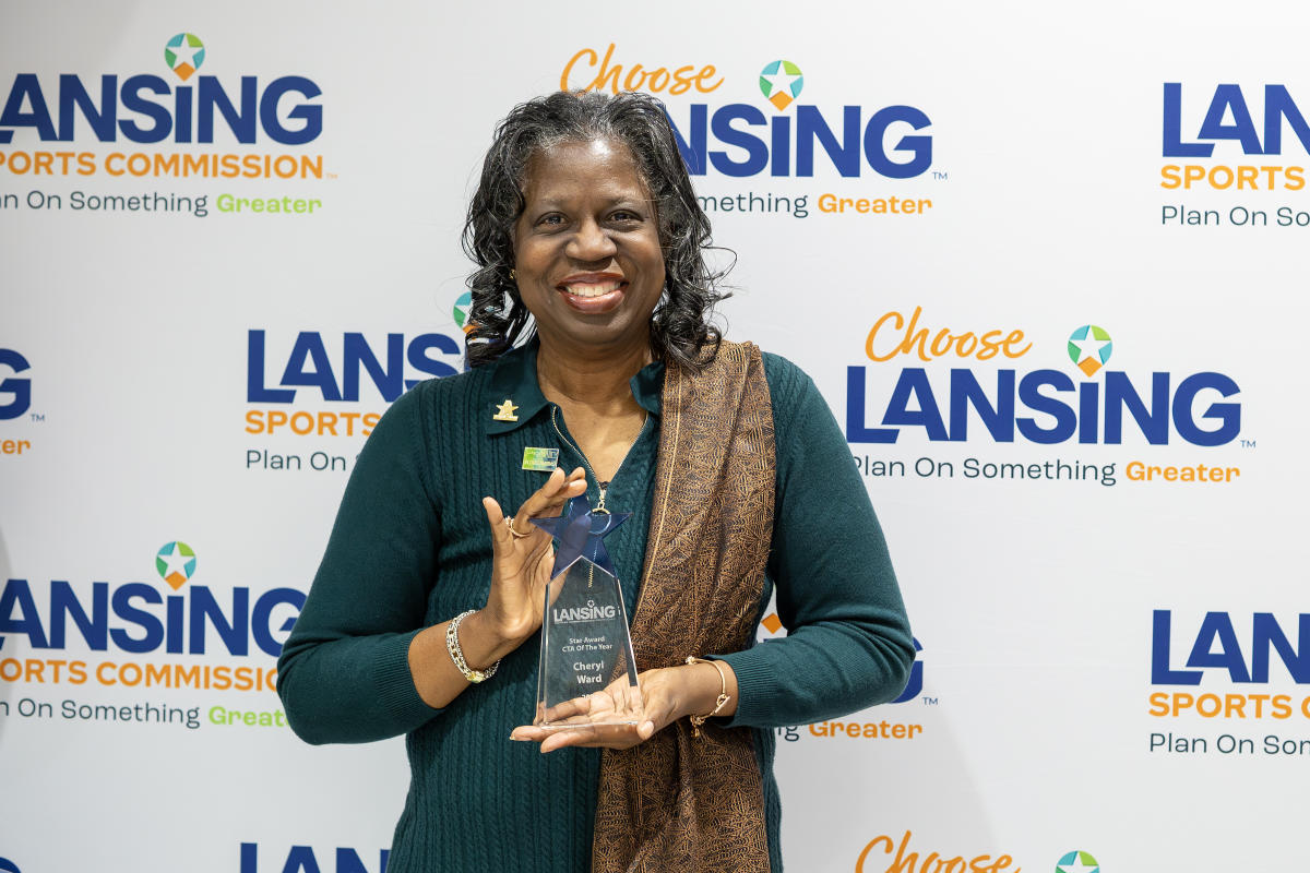 Cheryl Ward holding her CTA of the Year award