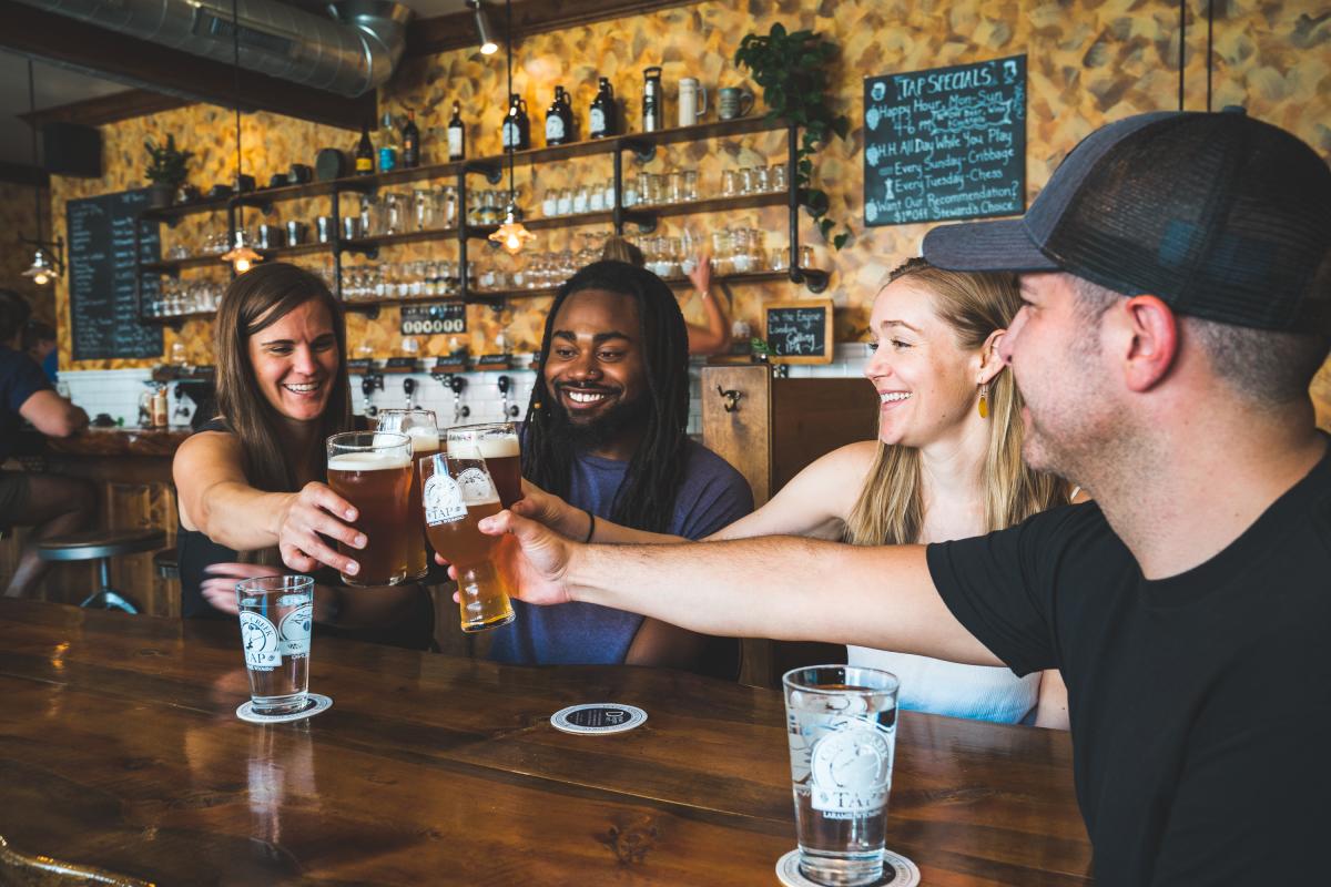 Friends on a brewery tour at Coal Creek Tap