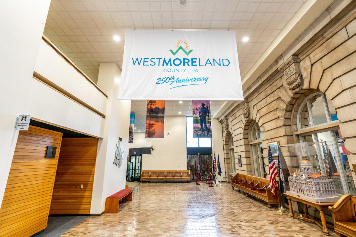 A banner celebrating Westmoreland County's 250th anniversary adorns the courthouse lobby in Greensburg.