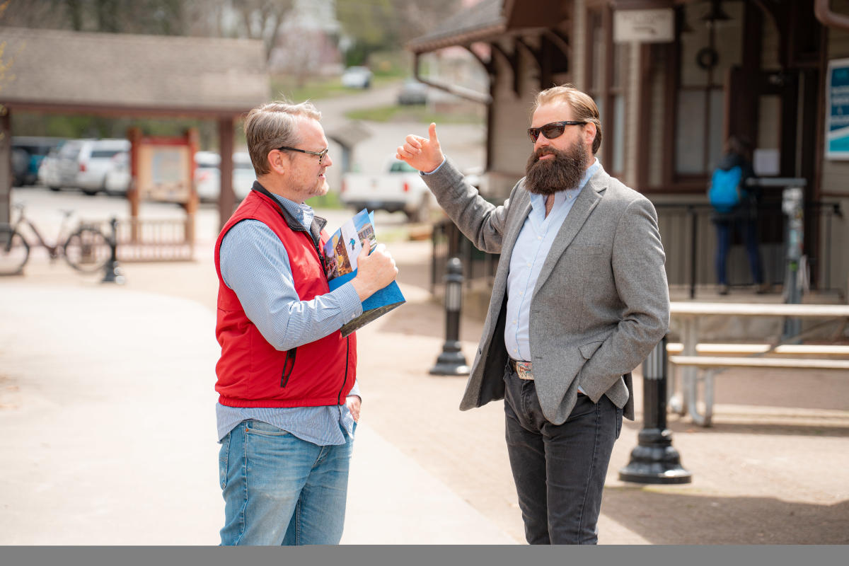 Nathan Reigner, Pennsylvania's director of outdoor recreation, and Bryan Perry, executive director of the Great Allegheny Passage Conservancy talk in Ohiopyle.