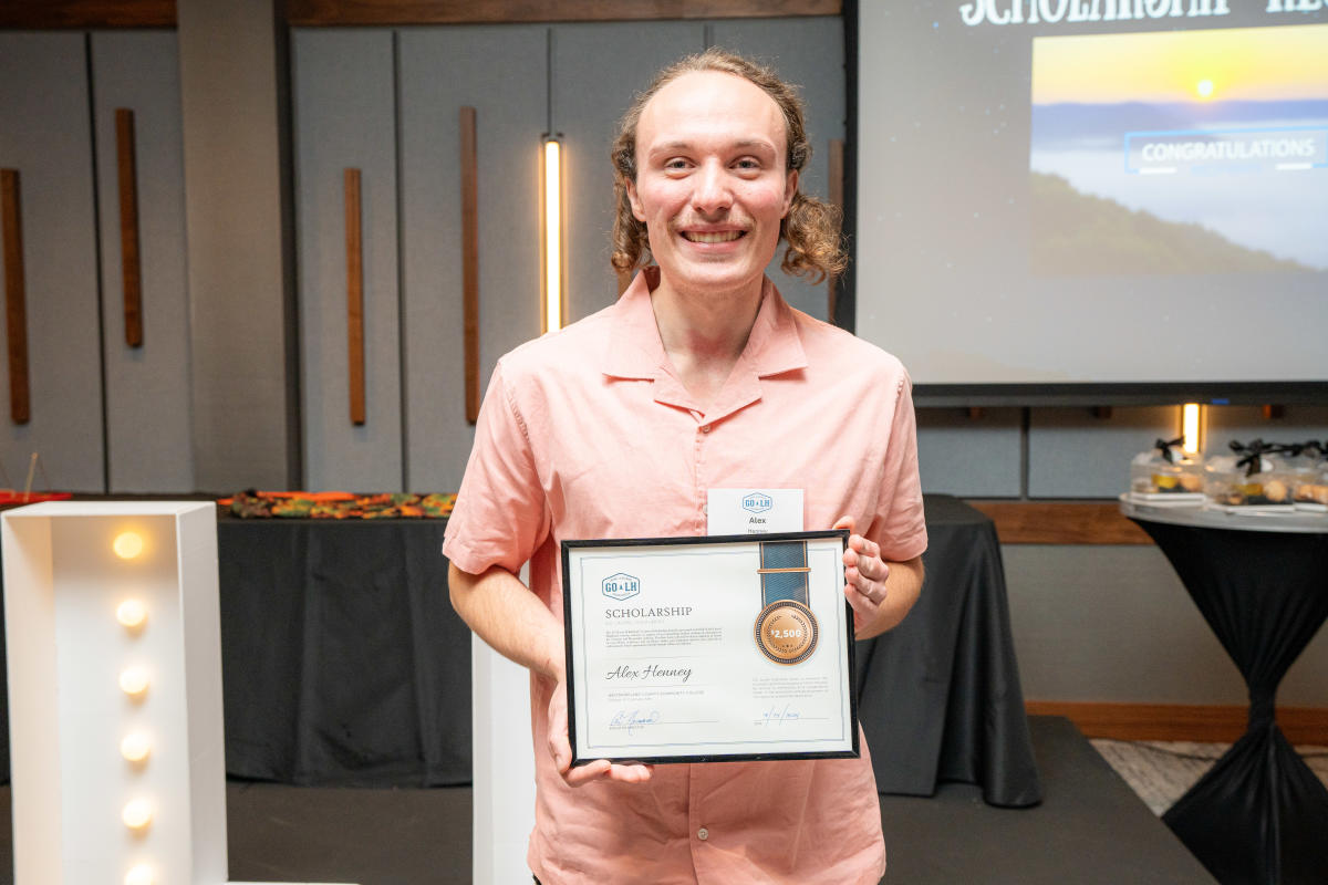Alexander Henney of Westmoreland County Community College receives a $2,500 scholarship award at GO Laurel Highlands' annual dinner at The Venue at Live! Casino in Greensburg.