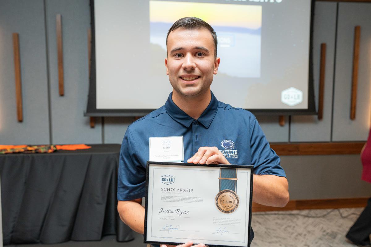 Justin Byers of Penn State Fayette receives a $2,500 scholarship award at GO Laurel Highlands' annual dinner at The Venue at Live! Casino in Greensburg.